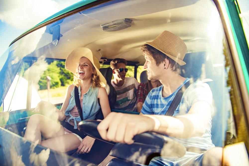 Beautiful young people on a road trip on a summers day