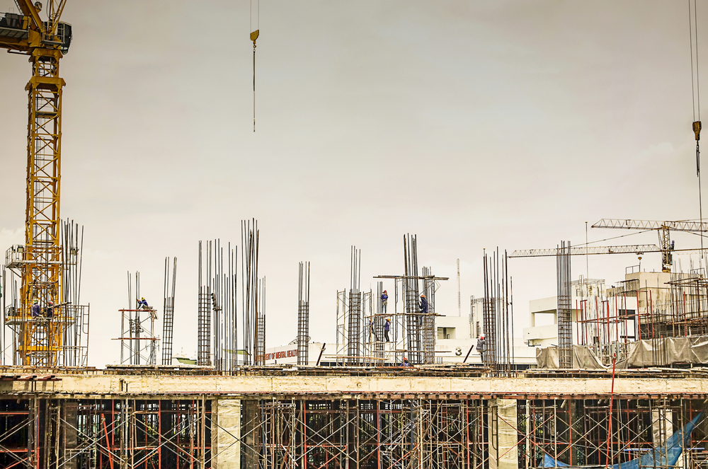 Construction site building and worker