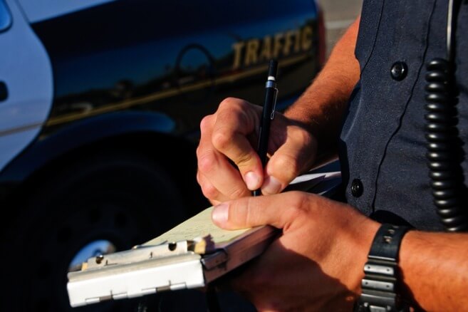 police writing traffic ticket in new york